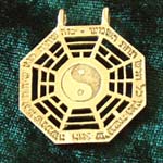 I Ching gold pendant